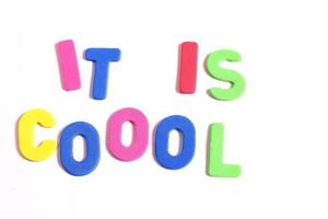 It is cool phrase lettering, colored letters on white photo