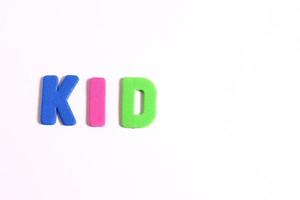 Kids lettering word, on white photo