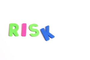 Word risk lettering, on white background photo