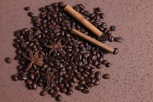 Coffee beans roasted on brown table photo