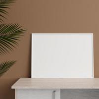 Minimalist front view horizontal white photo or poster frame mockup leaning against wall on table with plant. 3d rendering.