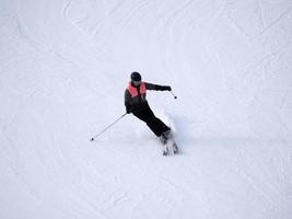 skier skiing in dolomites gardena valley snow mountains photo