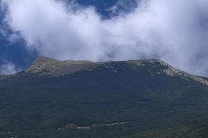 View of Mount Chatyrdag against the background of clouds. Mountain landscape photo