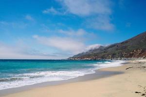 Sandy beach and small cliffs photo