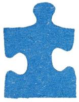 one blue tile of jigsaw puzzle photo