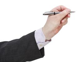 side view of businessman hand with silver pen photo