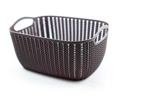 brown plastic basket with woven pattern on a white photo