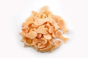 Fried prawn crackers or shrimp crackers in the shape of red fish photo