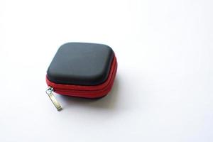 synthetic leather case for earphone storage on white background. photo