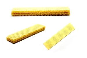 Delicious wafer sticks arranged in a pyramid shape isolated on a white photo