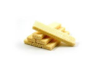 Delicious wafer sticks arranged in a pyramid shape isolated on a white photo