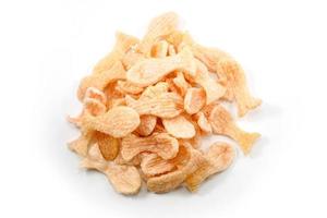 Fried prawn crackers or shrimp crackers in the shape of red fish photo
