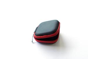 synthetic leather case for earphone storage on white background. photo