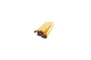 a collection of matchsticks neatly arranged isolated on a white photo