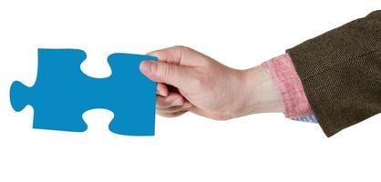 male hand with blue puzzle piece photo