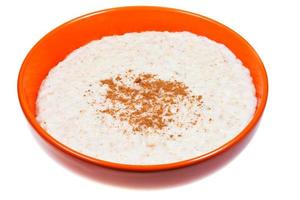 oat porridge with cinnamon in orange bow photo