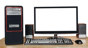 desktop computer with widescreen display on table photo