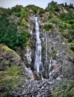 Waterfall in the alps photo