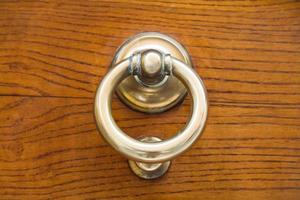 old brass ring door handle photo