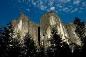 Massive rock and blue sky photo