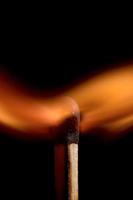 Burning matchstick and fire photo