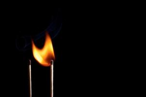 Burning matchstick and fire photo