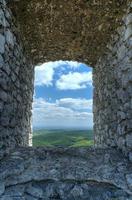 Stone window and sky photo