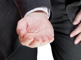 businessman holds handful - hand gesture photo