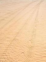 Tire imprint on sand of dune in Wadi Rum desert photo