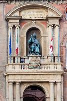 statue on facade of palazzo in Bologna city photo