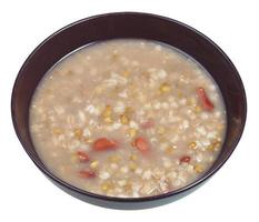 rustic bean soup in bowl isolated on white photo