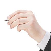 male hand with silver pen close up photo