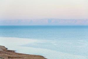 early pink sunrise on Dead Sea coast photo