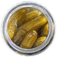 salted cucumbers in glass jar photo