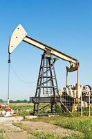 view of pumpjack pumping oil photo