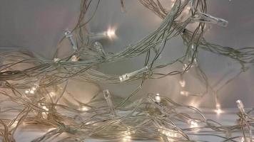 A flashing transparent garland carelessly wound into a heap. video