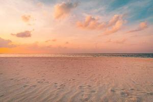 Closeup sea sand beach. Beautiful beach landscape. Inspire tropical beach seascape horizon. Dreamy sunset sky calm tranquil relax sunset summer mood. Positive energy, meditation summer tropical island photo