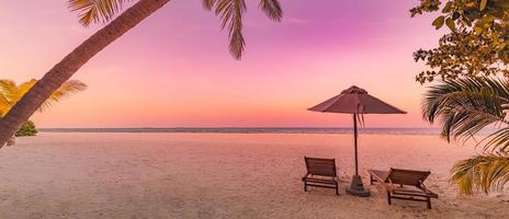 Beautiful beach panorama. Chairs on the sandy beach at seaside. Summer holiday vacation for couple tourism. Amazing tropical landscape. Tranquil scenic, relaxing beach tropical landscape, island shore photo