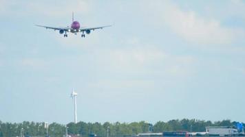 AMSTERDAM, THE NETHERLANDS JULY 26, 2017 - WOW Air Airbus 321 TF JOY approaching before landing on runway 18R Polderbaan. Shiphol Airport, Amsterdam, Holland video