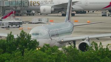 PHUKET, THAILAND NOVEMBER 26, 2016 - Qatar Airways Airbus 330 A7 ACI taxiing before departure. View from the top floor of the hotel Centara Grand West Sands Resort Phuket video