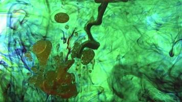 Colorful Paints Are Poured into Water video