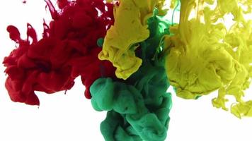 Colorful Paints Are Poured into Water video