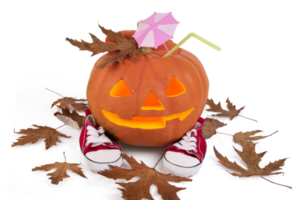 Halloween, orange pumpkin with glowing eyes, cocktail umbrella, cocktail straw and sneakers with autumn leaves. Transparent background. PNG