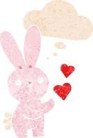 cute cartoon rabbit with love hearts and thought bubble in retro textured style vector