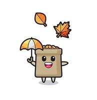 cartoon of the cute wheat sack holding an umbrella in autumn vector