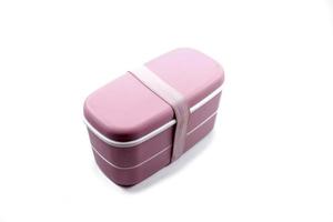 pink plastic lunch box isolated on white background. photo