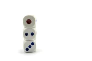 Three plastic dice isolated on a white background, a dice is a small object photo