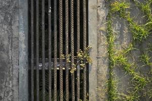 rusty brown housing scrap metal gutter. sewers for sewage and rainwater. photo