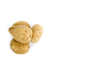 Three fresh potatoes isolated on a white background. photo