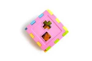 children's toy cube puzzle to recognize shapes, educational toys. photo